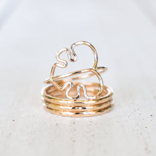 Set of Monstera leaf jewelry and stacking rings from Yay Hawaii, featuring gold-tone metal and tropical-inspired designs.