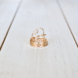 Set of Yay Hawaii Monstera and stacking rings featuring tropical leaf designs and gold-tone finish on a white background.