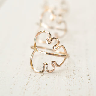 Set of Monstera and stacking rings by Yay Hawaii featuring silver bands and tropical leaf designs on a white background.
