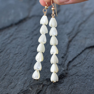 Small mother of pearl Pikake cluster earrings by Yay Hawaii featuring delicate white flower design and adjustable length.