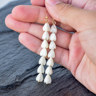 Small mother of pearl Pikake cluster earrings by Yay Hawaii featuring delicate pearl flowers and gold accents on a white background.