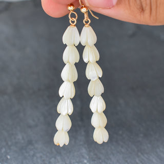 Small mother of pearl Pikake cluster earrings by Yay Hawaii featuring delicate pearl flowers and silver hooks.