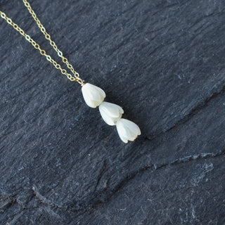 Triple small Pikake cluster vertical pendant necklace featuring floral design, from Yay Hawaii, on a delicate chain.