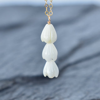 Triple small Pikake cluster vertical pendant necklace by Yay Hawaii featuring delicate floral jewelry with layered white flower charms.