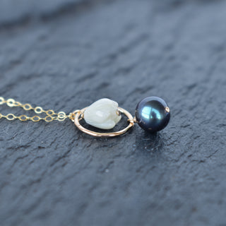 Small hoop earrings with mother of pearl Pikake design and black freshwater pearl necklace by Yay Hawaii.