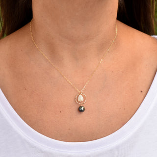 Small hoop earrings with Mother of Pearl Pikake flowers and black freshwater pearls from Yay Hawaii.
