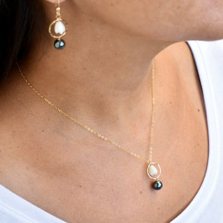 Small hoop earrings with mother of pearl Pikake design and black freshwater pearl necklace by Yay Hawaii.
