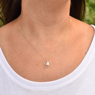 Yay Hawaii Hoop Pikake earrings with small mother of pearl Pikake flower in the center, featuring floral jewelry design.