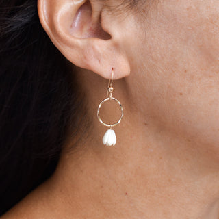 Gold hoop earrings with dangling small mother of pearl Pikake flower charms, Yay Hawaii jewelry.