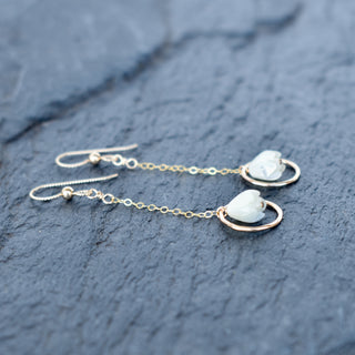 Dangling chain link hoop earrings by Yay Hawaii with small mother of pearl Pikake flower accents on a white background.