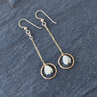 Dangling chain link hoop earrings by Yay Hawaii with small Mother of Pearl Pikake flower accents on a white background.
