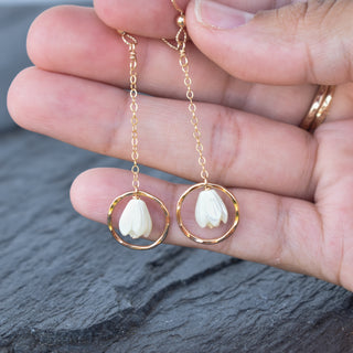 Dangling chain link hoop earrings by Yay Hawaii with small mother of pearl Pikake flower accents, stylish and elegant jewelry.
