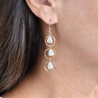 Triple hoop earrings by Yay Hawaii featuring small mother of pearl Pikake flower beads and intricate hoop designs.