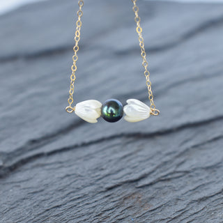 Small mother of pearl Pikake and black freshwater pearl bar necklace by Yay Hawaii, featuring elegant floral and pearl design.