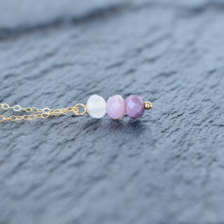 Purple ombre cluster necklace by Yay Hawaii featuring layered beads and vibrant design on a white background.