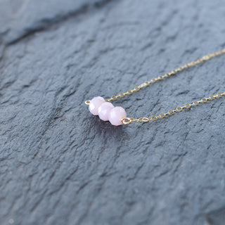 Dainty light purple crystal glass bead bar necklace by Yay Hawaii showing delicate chain and small purple beads on a white background.
