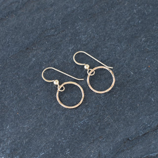 Tiny textured hoop earrings by Yay Hawaii featuring small gold hoops with a textured finish, ideal for everyday wear.