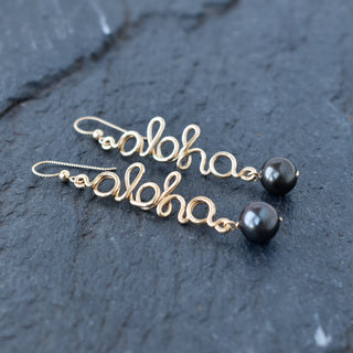 Black Pearl Aloha Dangle Earrings by Yay Hawaii featuring black pearl drops and tropical-inspired design.