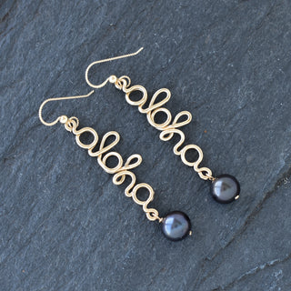 Black pearl aloha dangle earrings by Yay Hawaii featuring elegant black pearls and tropical-inspired design.