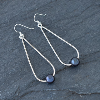 Long teardrop earrings with pearls by Yay Hawaii, featuring elegant silver hooks and dangling pearl accents.