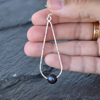 Long teardrop earrings with pearls by Yay Hawaii, featuring elegant gold-toned drops and lustrous pearl accents.