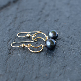 Crescent moon earrings with pearls from Yay Hawaii, featuring silver-toned metal and dangling pearl accents.