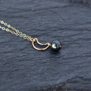 Yay Hawaii crescent moon necklace featuring an 8mm black freshwater pearl on a delicate chain.