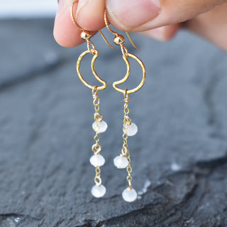 Dangling crescent moon earrings with white jade crystal glass beads, featuring Yay Hawaii jewelry design.