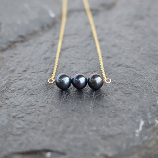 Yay Hawaii black freshwater pearl bar necklace with triple 8mm pearls, elegant jewelry piece on a neutral background