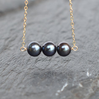 Black freshwater pearl bar necklace by Yay Hawaii featuring three 8mm pearls on a sleek chain.