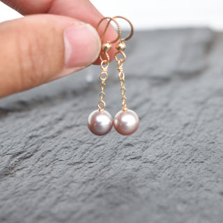 Light purple pearl dangle earrings by Yay Hawaii featuring a delicate single pearl design on silver hooks.