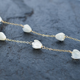 Small mother of pearl Pikake Station Necklace from Yay Hawaii featuring delicate pearl flower charms on a fine chain.