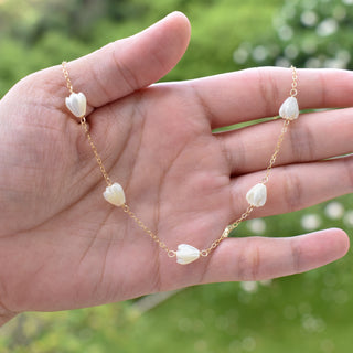 Small mother of pearl Pikake station necklace by Yay Hawaii with delicate pearl accents on a fine chain.