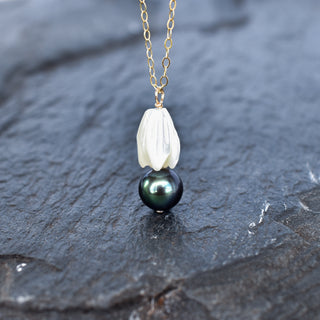Medium mother of pearl Pikake necklace and earrings set with black freshwater pearls by Yay Hawaii, featuring floral and pearl details.