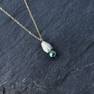 Medium mother of pearl Pikake flower with black freshwater pearl cluster necklace by Yay Hawaii, featuring floral jewelry design.