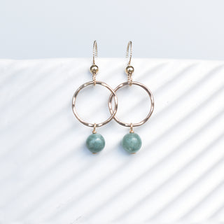 Small gold hoops with dangling 6mm jade gemstones, stylish earrings by Yay Hawaii, on a white background