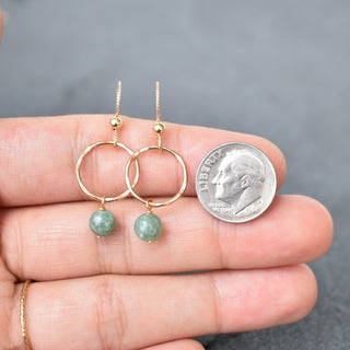 Small gold hoops with dangling 6mm jade beads from Yay Hawaii, showcasing elegant jewelry design.