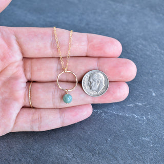 Small gold hoop necklace with dangling 6mm jade gemstone, stylish jewelry by Yay Hawaii featuring delicate design and vibrant green stone.