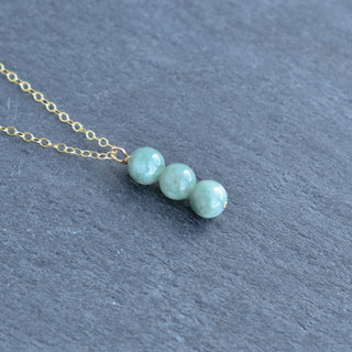 Yay Hawaii Triple 6mm jade cluster vertical pendant necklace with green jade beads on a silver chain, close-up view.