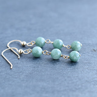 Triple linked 6mm jade dangle earrings by Yay Hawaii, featuring smooth green jade beads on silver hooks.