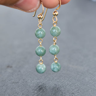 Triple linked 6mm jade dangle earrings by Yay Hawaii featuring smooth green jade beads and silver hooks.