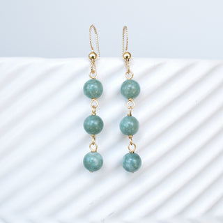 Triple linked 6mm jade dangle earrings with silver hooks, showcasing vibrant green jade stones and elegant jewelry design.