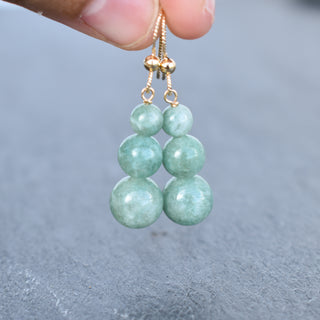 Graduated jade bead cluster earrings by Yay Hawaii featuring multiple green jade beads in a stylish dangle design.
