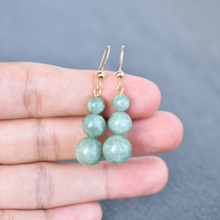 Graduated jade bead cluster earrings by Yay Hawaii featuring multiple green jade beads and gold-tone findings.