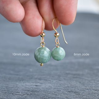 Yay Hawaii single jade drop earrings with 8mm or 10mm jade beads, featuring elegant gold hooks for a stylish look.