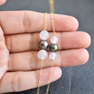 White agate and black freshwater pearl necklace featuring a stylish design, showcasing the elegant jewelry piece.