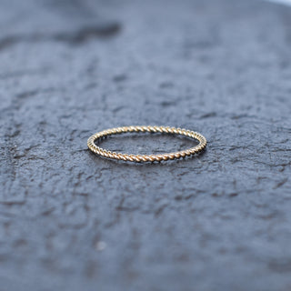 Silver Wili Twist stacking ring by Yay Hawaii with intertwined band design, showcasing a stylish and modern jewelry piece.