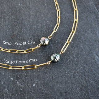 Paperclip necklace featuring a Tahitian pearl from Yay Hawaii, showcasing a sleek silver chain with a lustrous black pearl pendant.