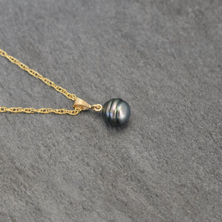 Tahitian pearl bail necklace featuring a round black pearl pendant on a delicate chain, by Yay Hawaii.