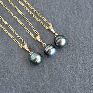 Tahitian pearl bail necklace featuring a large, round black pearl on a silver chain, designed by Yay Hawaii.
